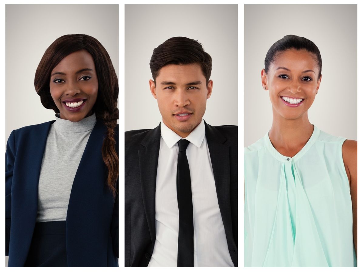 An ethnically diverse photo of two smiling women and men in business attire - Ethnically diverse illustrations and photographs will appeal to an increasing amount of people - Image - 
