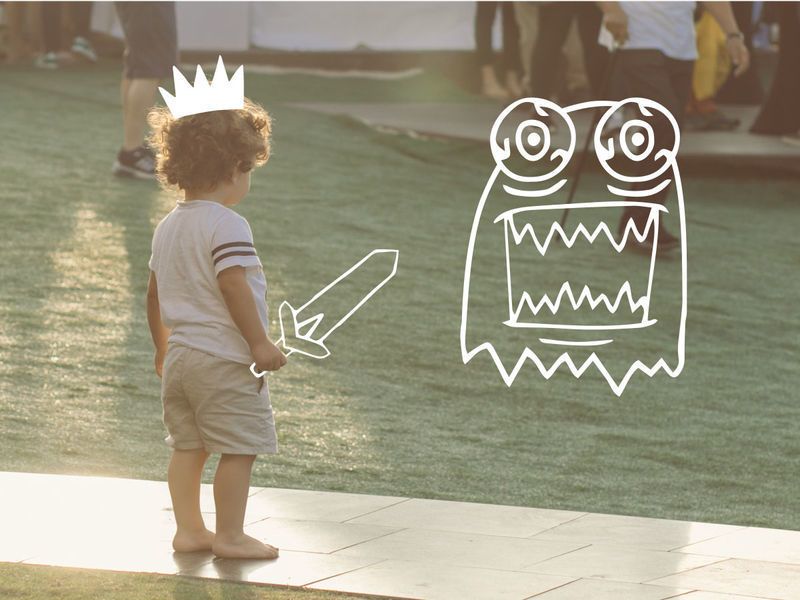 A child in shorts and a T-shirt stands by the water, with a crown, a sword, and a monster drawn on top of the photo - Combining illustrations with real photographs in a design can open up unexpected perspectives - Image