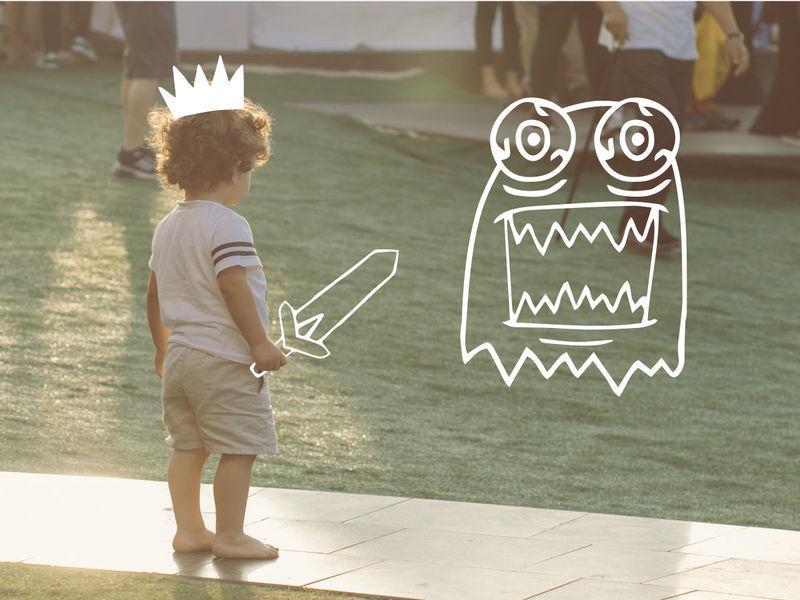 A child in shorts and a T-shirt stands by the water, with a crown, a sword, and a monster drawn on top of the photo - Combining illustrations with real photographs in a design can open up unexpected perspectives - Image