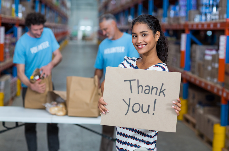 Portrait of woman holding sign boards with thank you message - Image