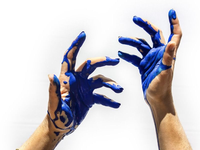 Image of hands covered with blue paint - How to make a YouTube video in 5 simple steps - Image