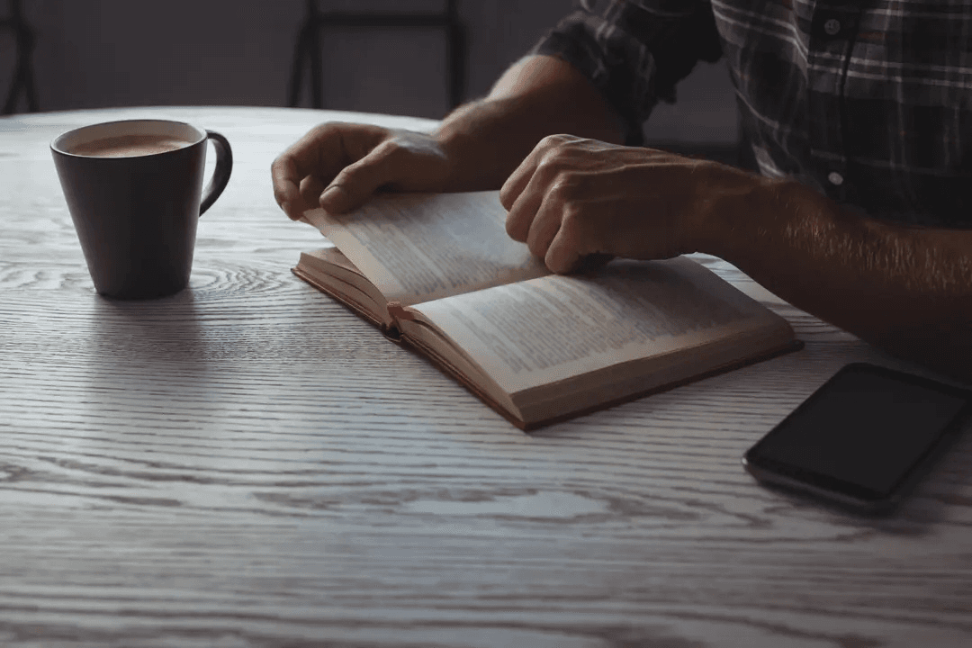 Mid section of businessman reading book - Image