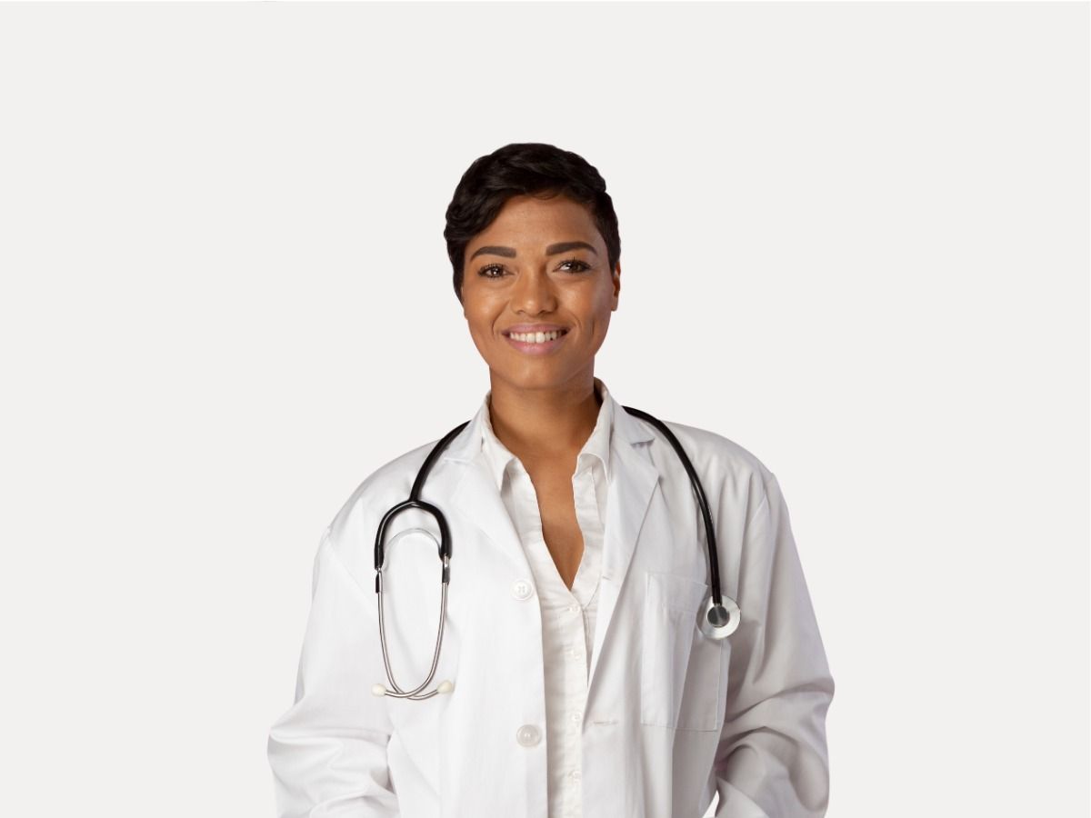 A female doctor in a white coat with a stethoscope smiles at the camera; LinkedIn profile picture - Tips for choosing the best profile photo for different social networks - Image