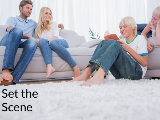 Family sitting together in living room with children on tablet - Instructions on how to reach your desired audience using real estate marketing - Image