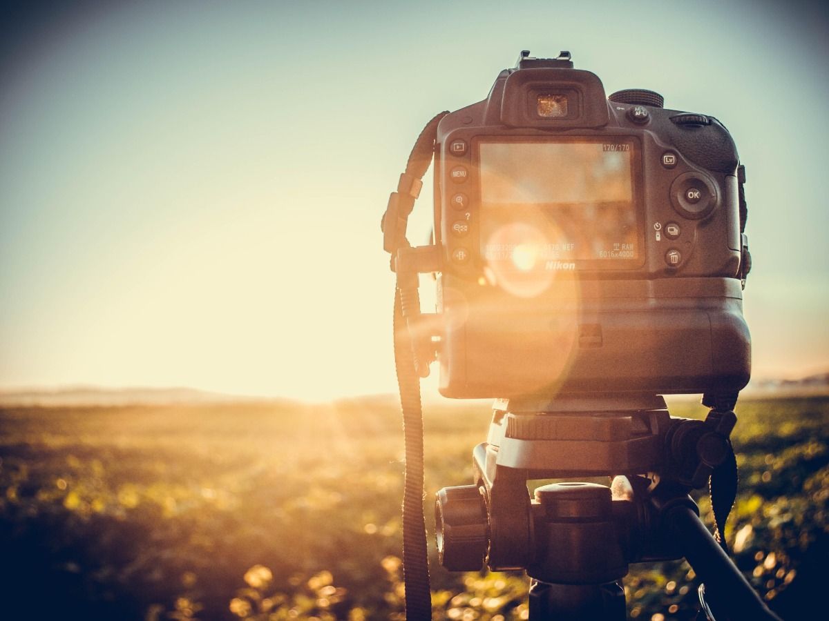 Photo of a camera on a tripod - Essential video marketing tips for beginners in 2021 - Image