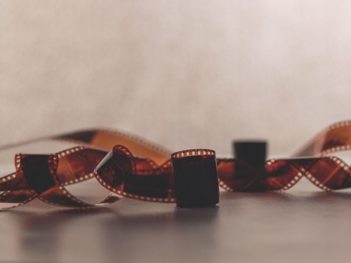 Camera film rolls are lying on the table - Essential video marketing tips for beginners in 2021 - Image