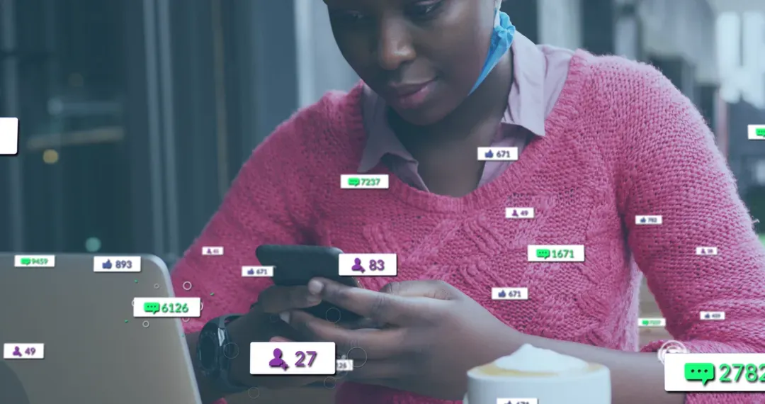 Image of social media icons with growing numbers over african american woman using smartphone - Image