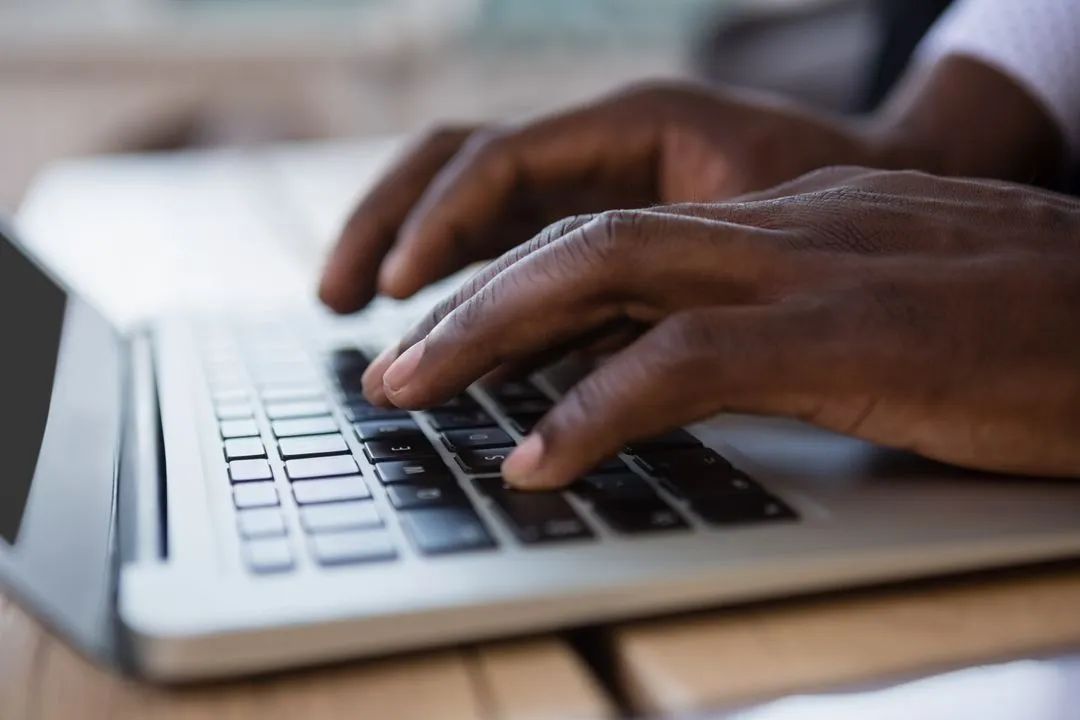 Hands of businessman using laptop - Image