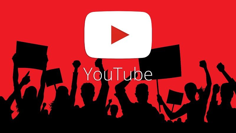 YouTube logo and silhouettes of a protesting crowd - YouTube video marketing tips and tricks - Image